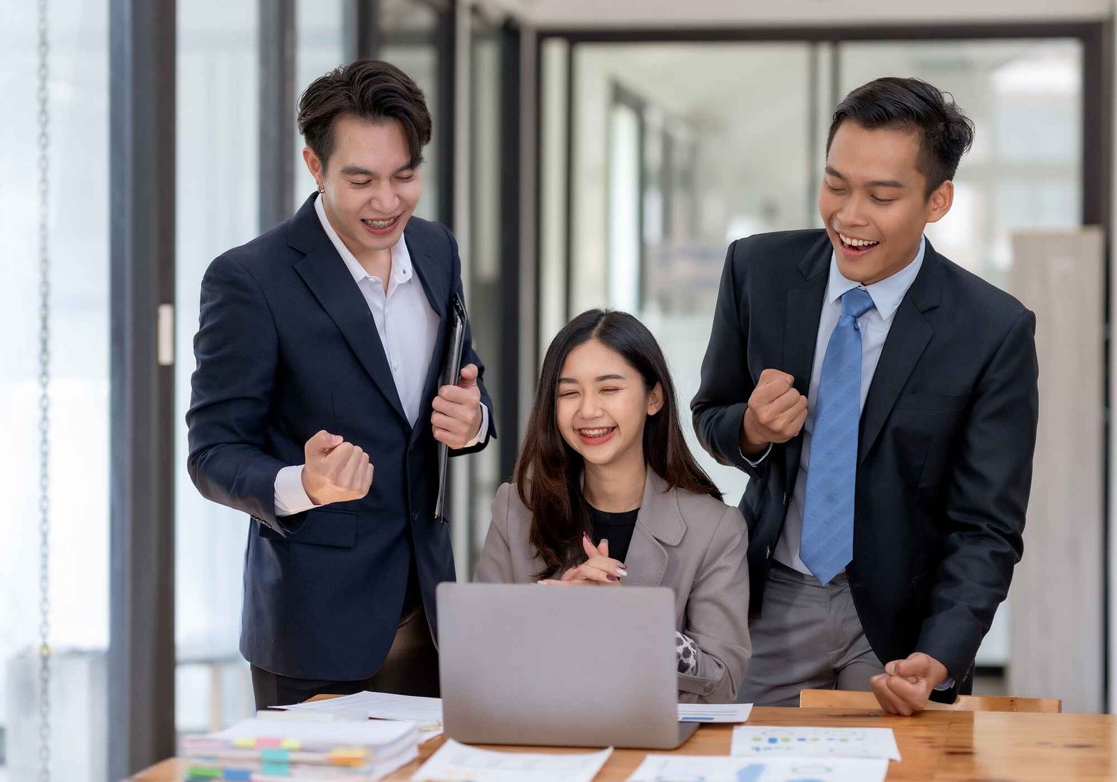 business team celebrating success at the office wi j2pxxwm.jpg