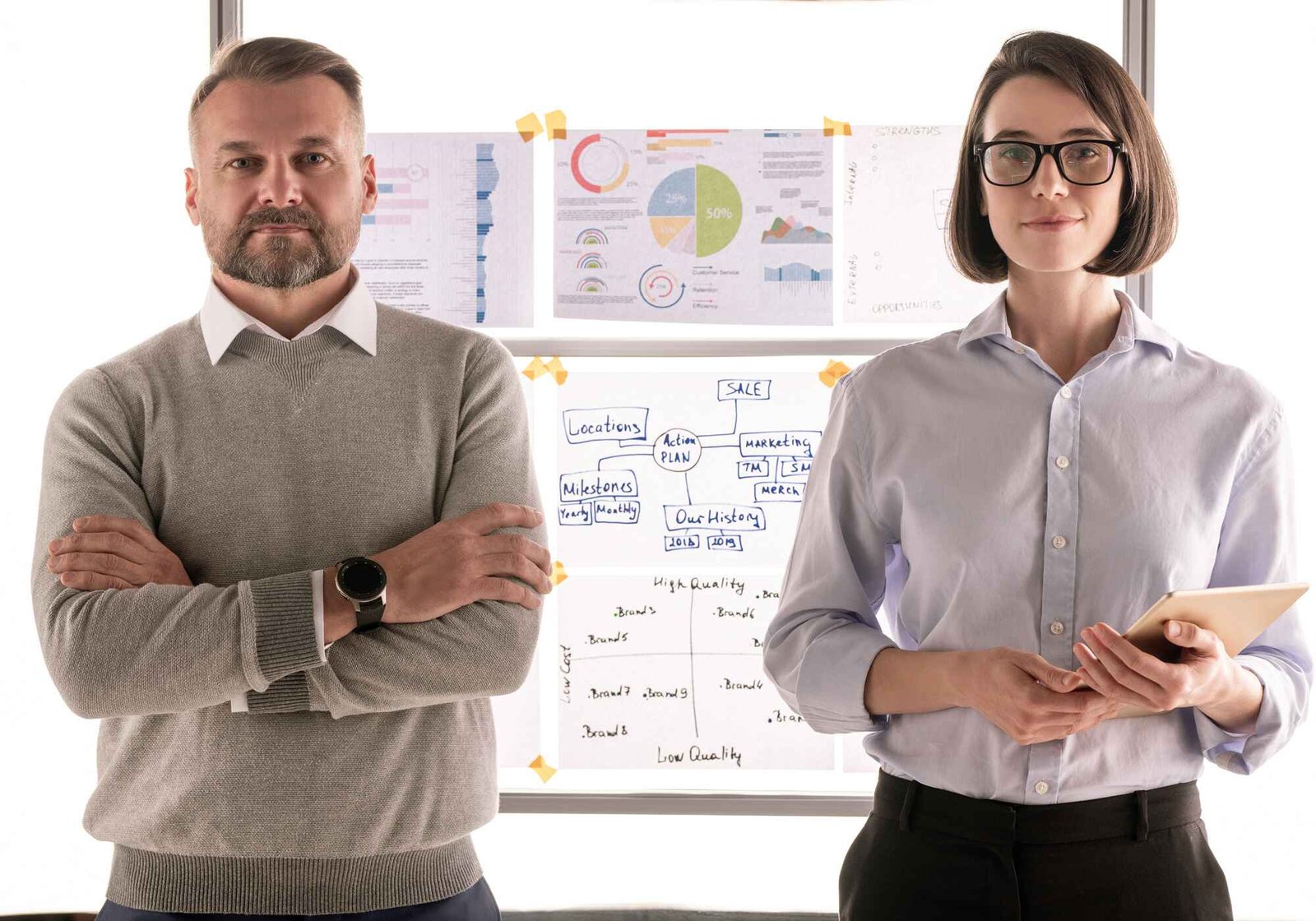 two confident financiers in formalwear standing in kukwkre.jpg